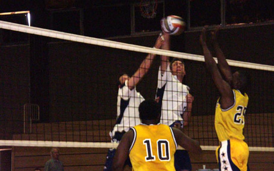 Ramstein&#39;s Brandon Gallant, left, and Ron Istre converge on the ball Sunday during the USAFE champion Rams&#39; victory over Army-Europe champion Heidelberg in the 2004 U.S. Forces Europe volleyball tournament. Heidelberg&#39;s Wilford Byrd (10) and Michael Hilliard (25) await the delivery.