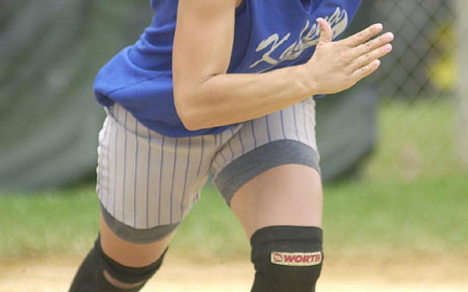 Right-center fielder Jamie Bailey of the Kadena Falcons begins her run to first base after singling against the Kadena Outkast during Monday's women's championship game of the 9th Firecracker Shootout Open Softball Tournament at Field 2, Foster Field Complex, Camp Foster, Okinawa. Bailey, an All-Marine, went 4-for-5 with four RBIs as the Falcons routed the Outkast 20-2 in the all-Okinawa final.