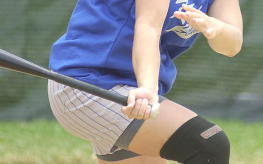 Right-center fielder Jamie Bailey of the Kadena Falcons watches her single sail to the outfield against the Kadena Outkast during Monday&#39;s women&#39;s championship game of the 9th Firecracker Shootout Open Softball Tournament at Field 2, Foster Field Complex, Camp Foster, Okinawa. Bailey, an All-Marine, went 4-for-5 with four RBIs as the Falcons routed the Outkast 20-2 in the all-Okinawa final.