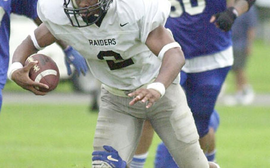 Yokota Raider John Wilson runs with the football in a 50-0 Raider victory over the Atsugi White Dolphins in USFJ Football action Saturday at Naval Air Facility Atsugi, Japan.