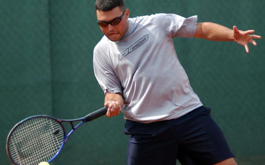 Joel Bond returns a serve during a semi-final doubles match at the U.S. Forces Europe Tennis Championship in Heidelberg, Germany, on Sunday.