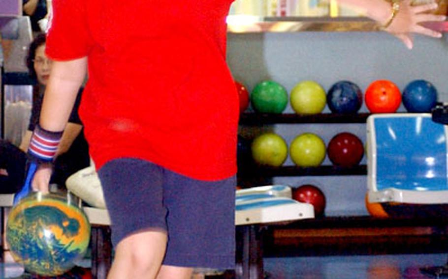 Victoria Wallace bowls at the Yongsan Post Lanes, Yongsan Garrison, South Korea, on Tuesday.