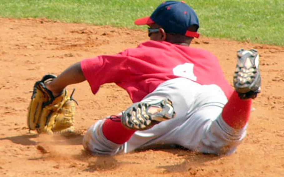 Ramstein second baseman Dreshawn Murray dives to keep a ground ball off the bat of London&#39;s Josh Halvorson from going into center field in the sixth inning of Ramstein&#39;s 8-6 victory over England on Tuesday in Kutno, Poland. Halvorson beat Murray&#39;s throw to first, however, to register the only hit pitcher Stephen Braden yielded in three innings of relief.