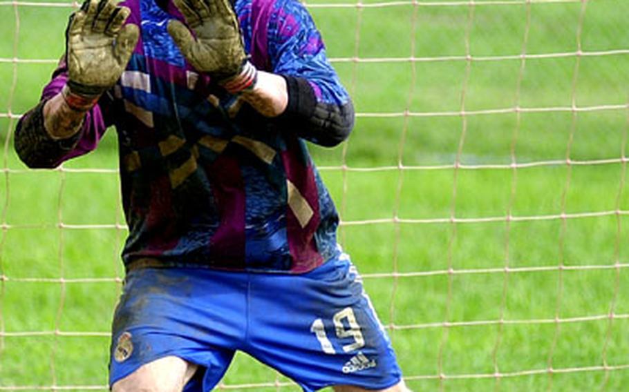 1st Marine Aircraft Wing goalkeeper Michael Mulroney prepares to stop a penalty-kick shootout attempt by Michael Garcia of 3rd Force Service Support Group during Tuesday&#39;s pool play. Wing won the shootout 5-4, and won the match 3-2.