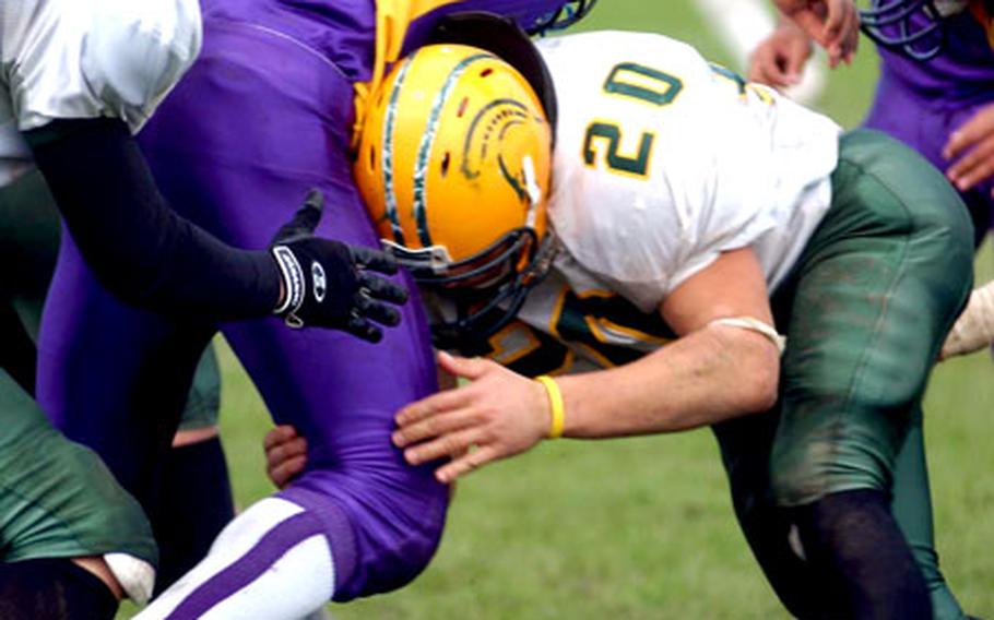 Mannheim running back Jamal Womble, center, fumbles after a hard hit by SHAPE&#39;s Richard Rendon.