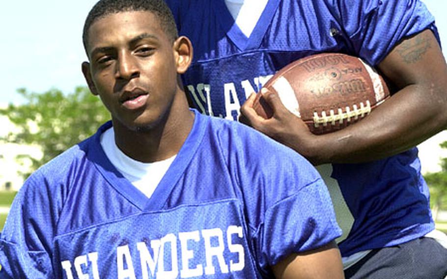 Senior running backs David McCowan (10) and Keith Loving have been instrumental in leading the Kadena Islanders into the top spot in the Okinawa Activities Council football standings.