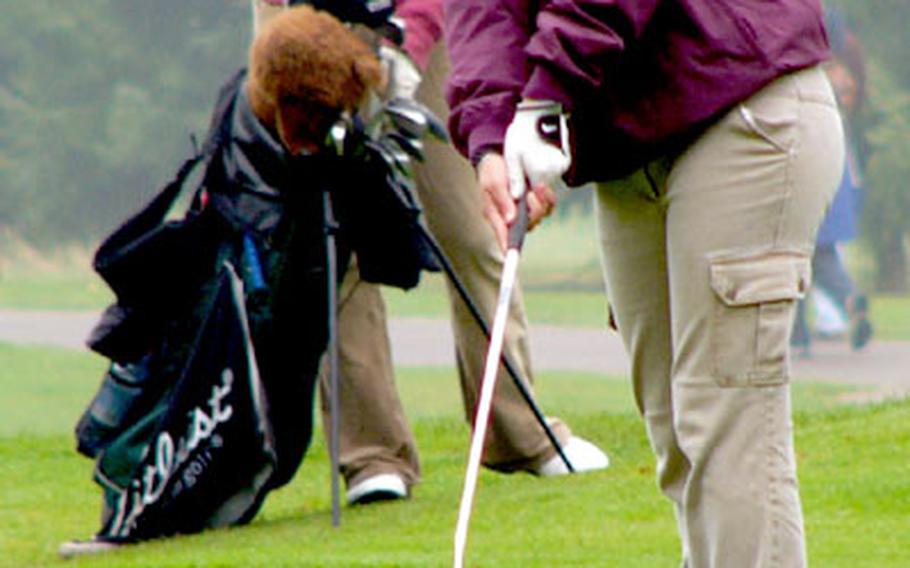 Defending girls&#39; champion and first-day leader Frances Smythe of Würzburg sends an attempt to save par on No. 18 toward the cup Thursday during the opening round. Smythe pushed the shot just wide of the hole and settled for a bogey-six and two Stablefored points to give her 24 for the day. In the background is Sarah Wells of Lakenheath, who trails Smythe by five points going into Friday&#39;s final round.