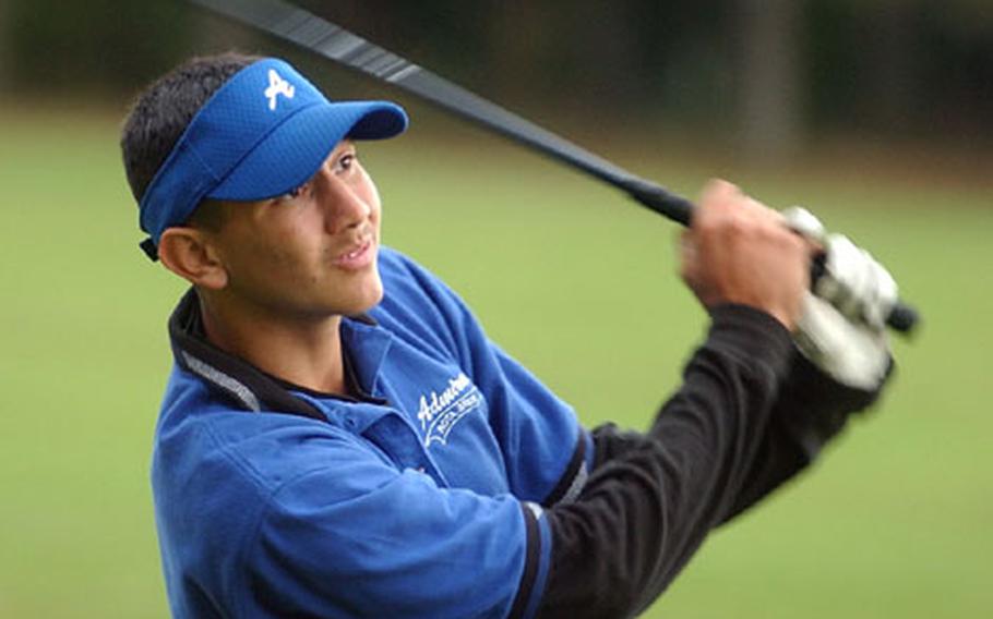 Rota&#39;s Gilbert Mendez watches his tee shot on the 10th hole during the DODDS European Golf Championships on Friday.