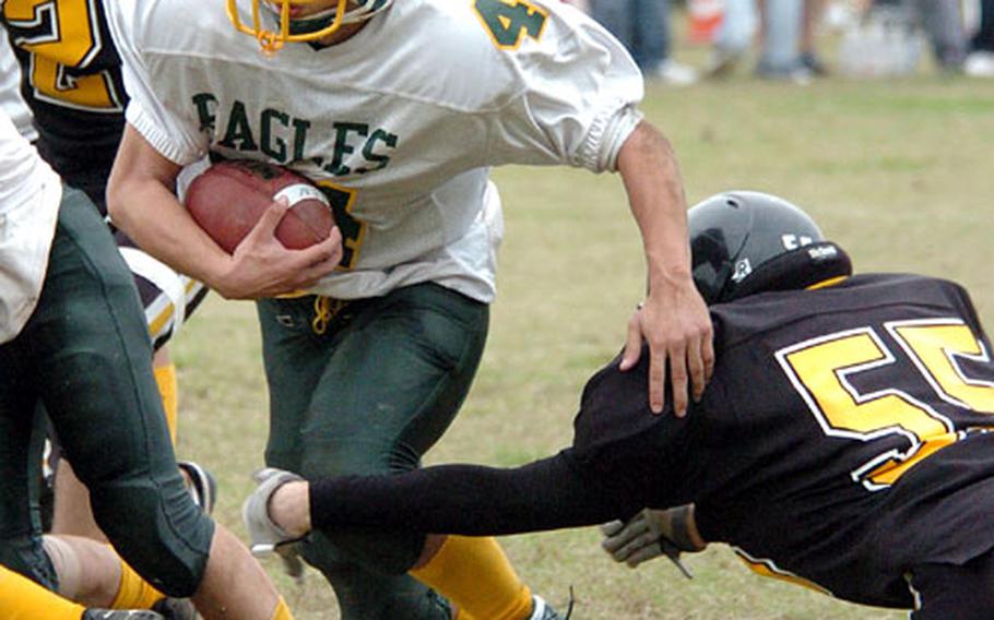 Jeff Fotakis of Robert D. Edgren runs the ball in the fourth quarter of Saturday&#39;s game at the American School In Japan&#39;s Mustang Valley. ASIJ won, 10-7.