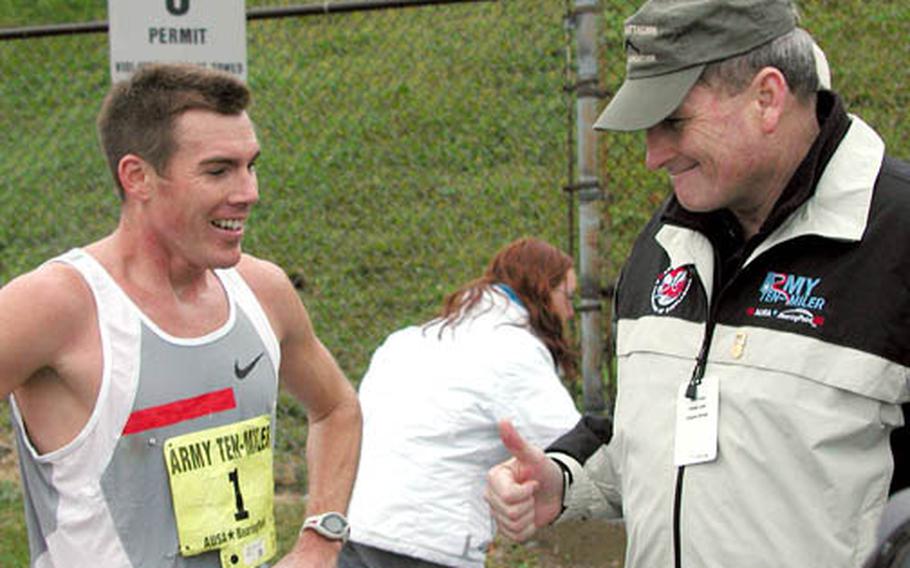 Gen. Peter Schoomaker, Army chief of staff, gives 2004 Army Ten Miler champion Capt. Dan Browne a "thumbs-up" after the race. Browne finished in a time of 47:29, breaking his own course record.