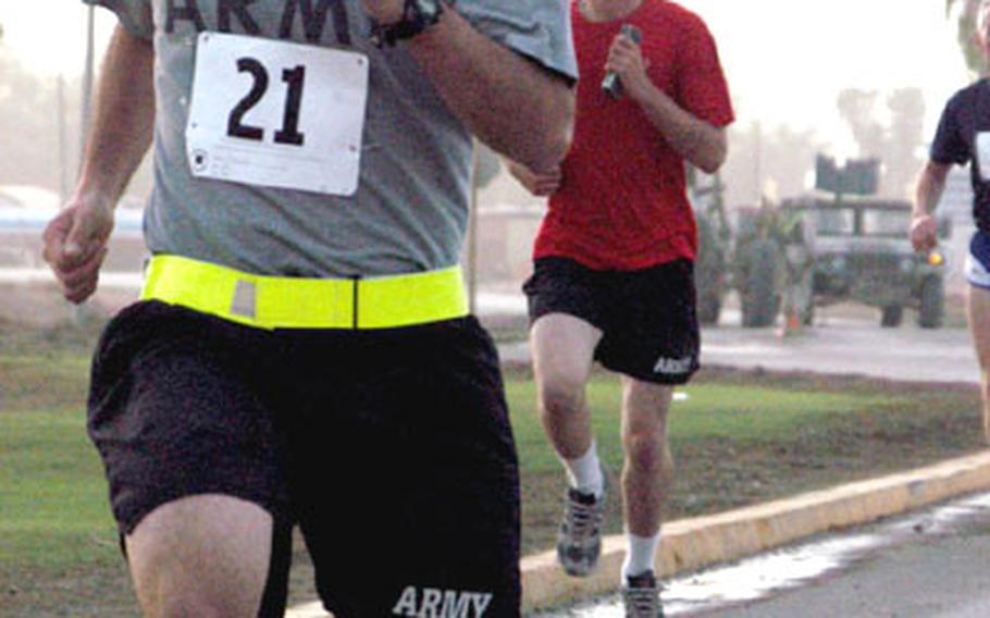 Runners participating in the race at Anaconda were watched over by armed servicemembers in Humvees like the one in the background.