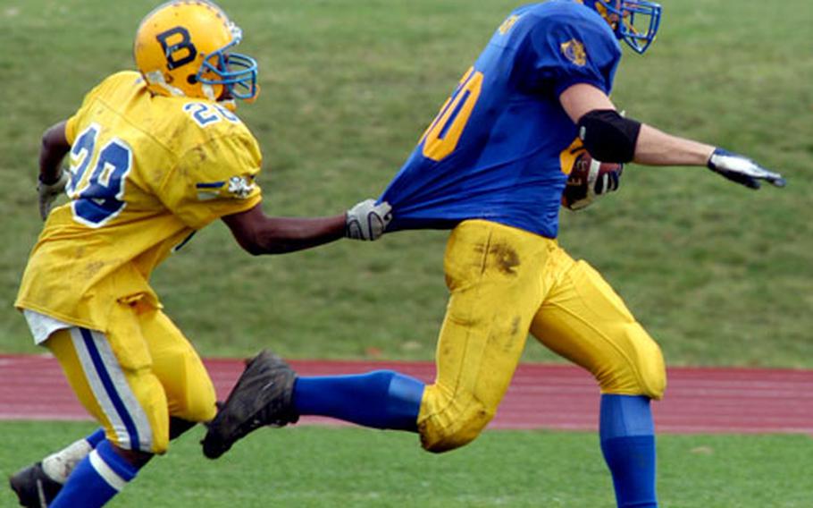 Bamberg&#39;s T&#39;andre Stuckey gets hold of Adam Golden&#39;s jersey, but can&#39;t stop him from scoring in Ansbach&#39;s 45-14 semi-final win over Bamberg. The Ansbach lineman got the ball on a broken play and scampered in for the TD.