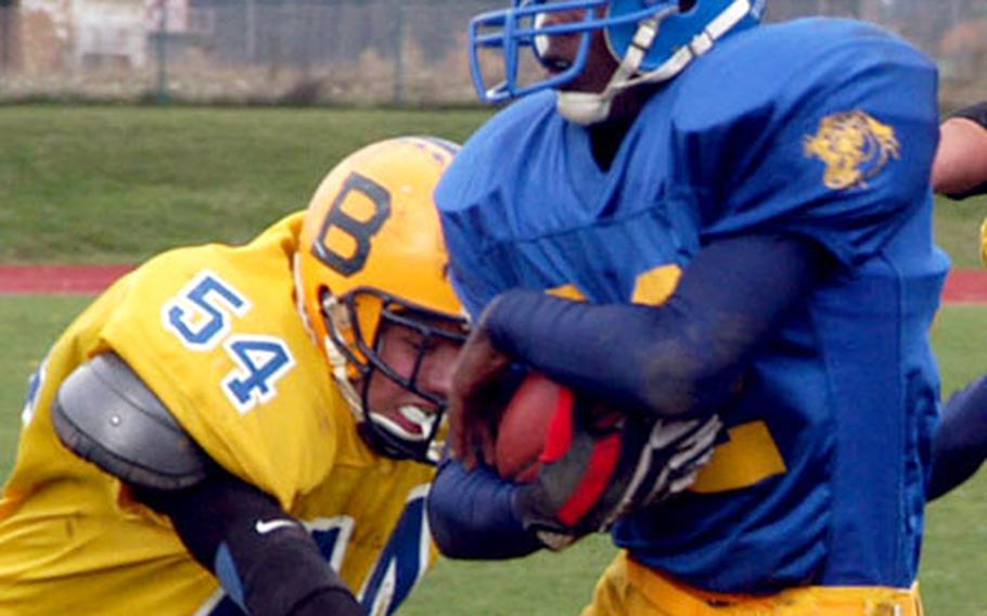 Ansbach&#39;s Dameon Outley, breaks a tackle by Bamberg&#39;s Ben Woomer on the way to his second touchdown of the day.