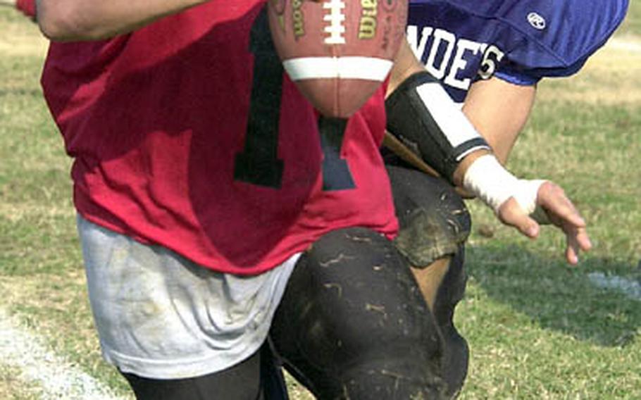 Buccaneers quarterback Tyler Schmidt tries to elude the defensive pressure of the Islanders&#39; Greg Munroe.