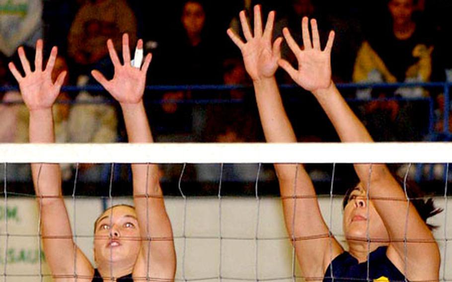 Heidelberg&#39;s Courtnee Sharpe, left, and Natasha Holan go up for a block in the Division I final at the DODDS-Europe volleyball championships in Kaiserslautern on Saturday.