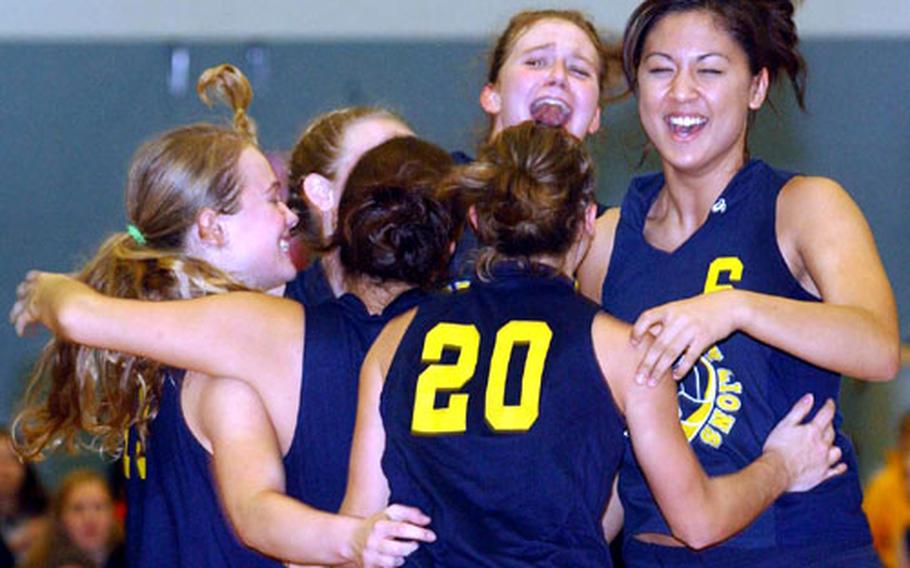 The Heidelberg Lions celebrate their second straight Division I title after defeating Frankfurt International School 25-16, 25-18, 25-23 at the 2004 DODDS-Europe volleyball finals.