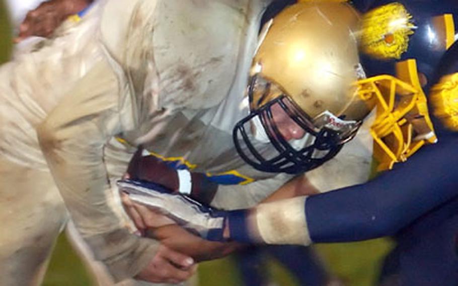 Wiesbaden&#39;s Paul Fry bowls over Heidelberg defenders for one of his four touchdowns.