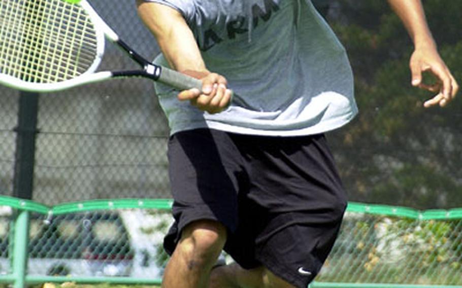 James Edwards of South Korea&#39;s Pusan American Panthers charges to hit a forehand during Thursday&#39;s mixed doubles match. Edwards and his sister, Mary, beat Justin Lee and Jackie McGinn of the Seoul American Falcons 6-3, 6-2.