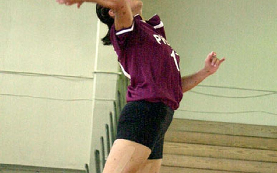 Senior middle blocker Yuri Koshibe of Tokyo&#39;s Seisen International Phoenix jump serves against the Seoul American Falcons Thursday. Jump serving exclusively, Koshibe netted four aces, including four straight in the second set, which Falcons coach Denny Hilgar said intimidated his team en route to a 25-13, 25-18, 25-22 defeat.