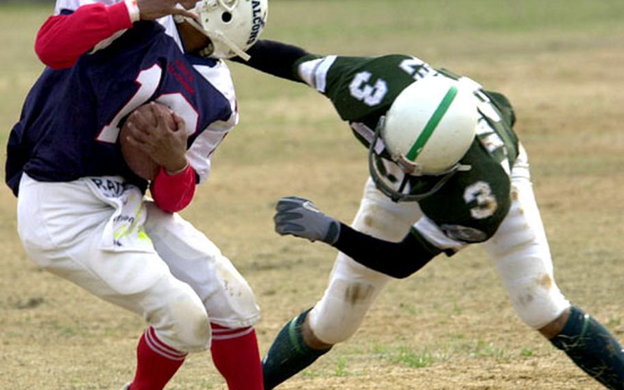 Seoul American&#39;s Phillipe Anglade gets taken down by Singapore&#39;s Gregory Martinez during Saturday&#39;s World Bowl.