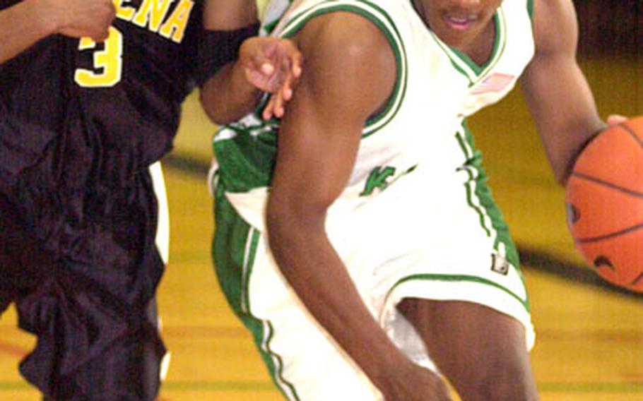 Kubasaki guard Steve Ellis dribbles past Kadena guard Terence Reid during Friday&#39;s game. Ellis scored 20 points, while Reid countered with 18, including five three-point goals, as Kadena outlasted Kubasaki 103-93.