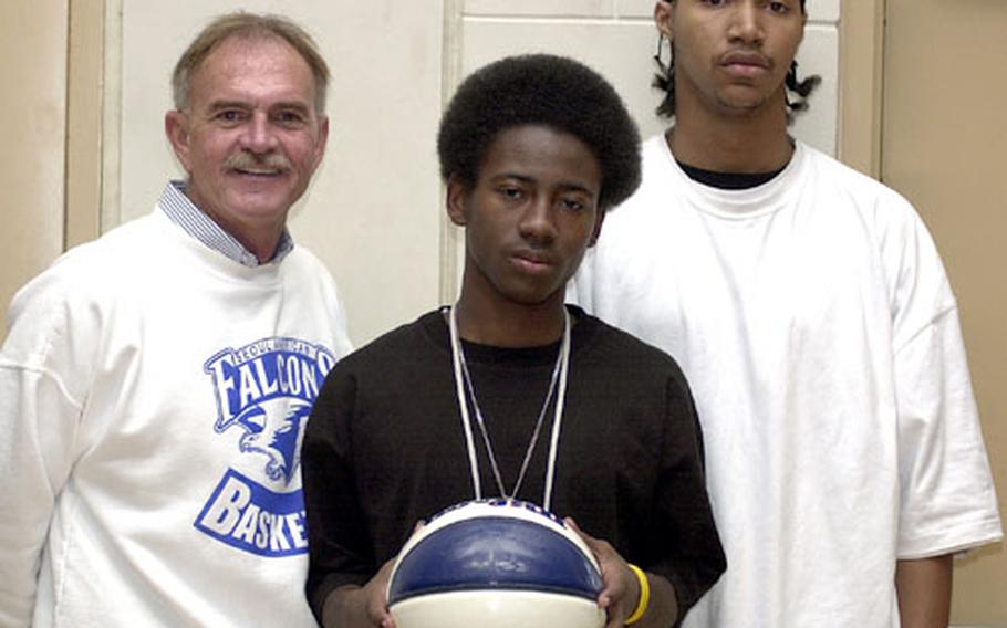 Coach Steve Boyd, left, is counting on his junior backcourt tandem of Jamaal Mohn, center, and Jay Higgins — the "J-Birds" — to help fuel the Seoul American Falcons&#39; bid for another Far East High School Boys Class AA (large schools) title.