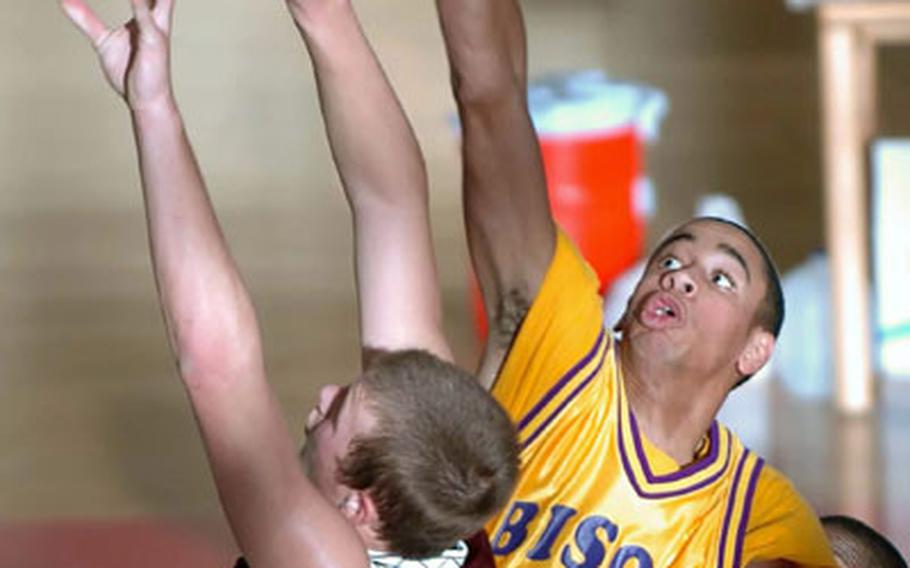 RVilseck&#39;s Kevin Pollack, left, has his shot blocked by Mannheim&#39;s Reggie Jenkins during Saturday&#39;s game at Mannheim, Germany. Mannheim defeated Vilseck 49-47.