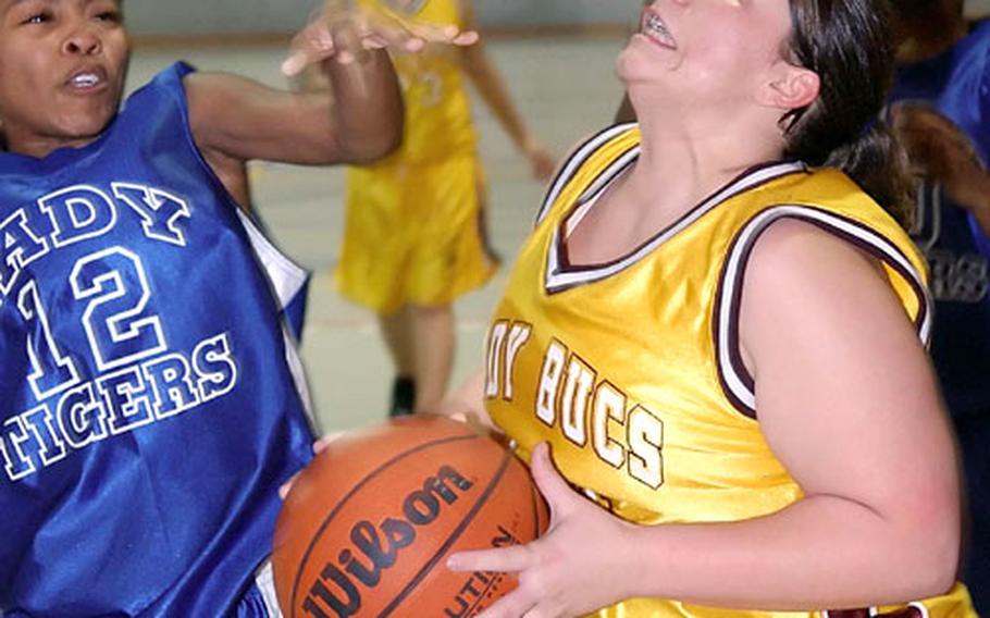Baumholder&#39;s Shawntae Price, right, looks to put up a shot against Hohenfels&#39; Mica Nicholson during Friday&#39;s game.