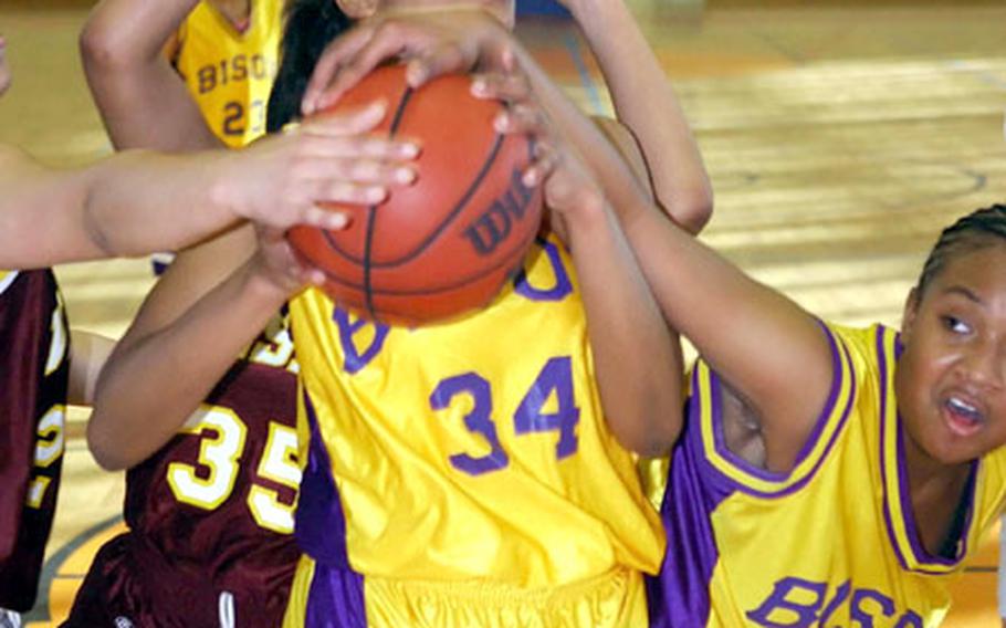 Mannheim&#39;s Jasmine Lee, center, is fouled while trying a shot during Saturday&#39;s game against Vilseck at Mannheim, Germany. Mannheim defeated Vilseck 47-45.
