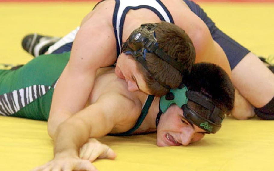 Naples&#39; Michael Monaco, bottom, tries to get out from under Bitburg&#39;s Devon Gardner during the 130-pound finals of the 2004 DODDS European Wrestling Championships in Wiesbaden, Germany. Monaco, who won the title, is looking for another crown, this time at 140 pounds.