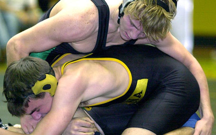 Kubasaki's Steve Courtney gets the upper hand on Kadena's Ian Copeland, during a dual meet at Kadena High School, Kadena Air Base, Okinawa. Courtney defeated Copeland and enters this week's Far East tournament as one of the favorites at 148 pounds.