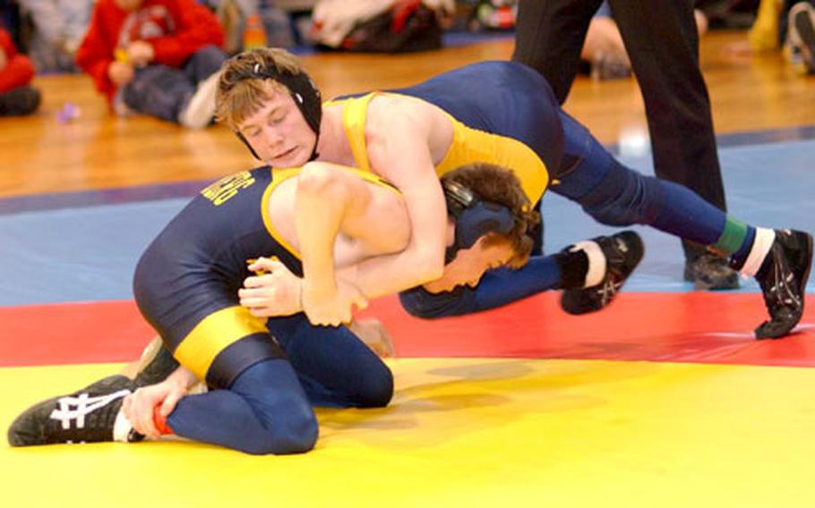 Wiesbaden’s Tony Gagnon, top, tries to flip Heidelberg’s Jeremy Brady during the 2004 DODDS Division I championships in Schweinfurt, Germany. Gagnon won the Div. I title last year despite wrestling with a torn ACL.