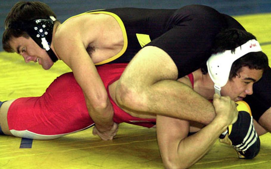 Devon Copeland, top, of Okinawa&#39;s Kadena Panthers and Joey Wood of Japan&#39;s Nile C. Kinnick Red Devils battle it out dat 168 pounds on Thursday, the first day of the Far East High School Wrestling Tournament at Yokota Air Base, Japan. Copeland rallied from a 5-0 deficit to pin Wood in 4 minutes, 13 seconds.