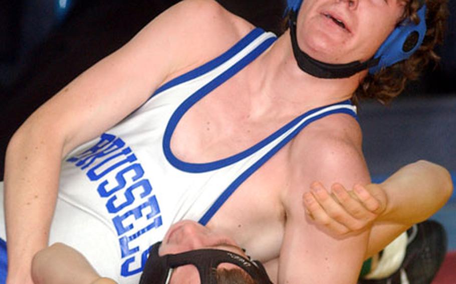 Kevin LaBelle of Brussels puts the pressure on Kyle Stammer of Vicenza in a first-round 135-pound match on the first day.