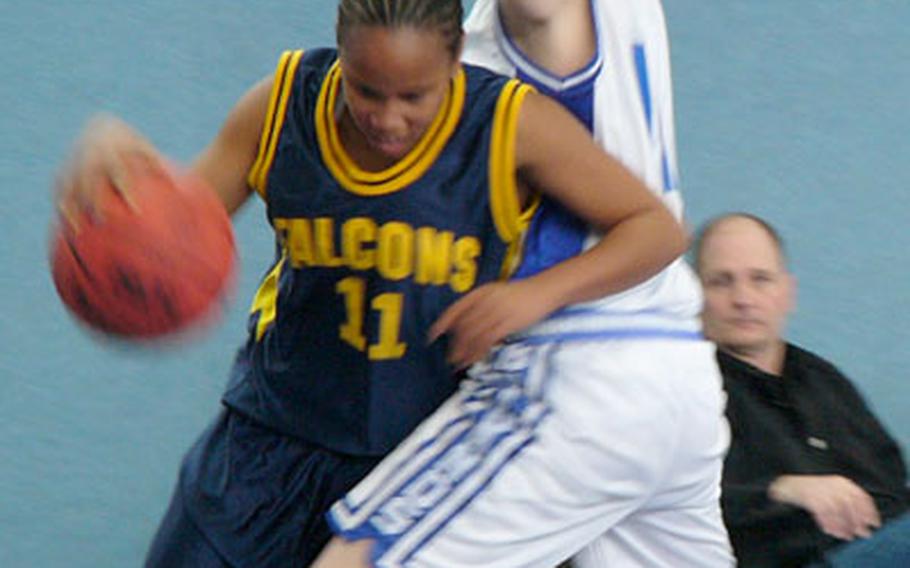 Brussels&#39; Katie Weatherbie, right, attempts to deny the baseline to Lajes guard Kelly Boxley during the Lady Brigands&#39; 35-12 conquest of Lajes in a Division IV first-round game Wednesday in Schwetzingen, Germany. The game was one of 50 games played at six sites in the Mannheim-Heidelberg area on the first day of the European Division I, II, III and IV tournaments for boys and girls.