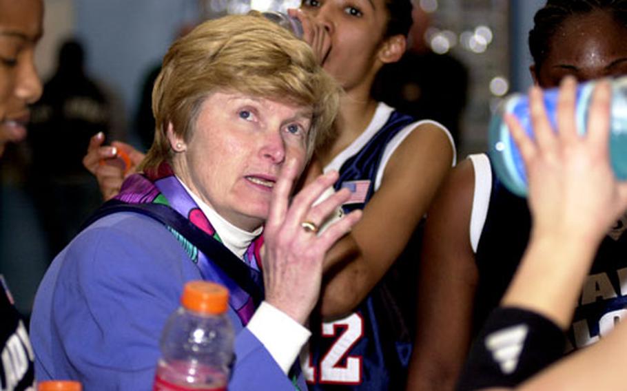 Seoul American coach Charlotte Hicks gazes at the clock while instructing her players during a timeout in Saturday&#39;s championship game. The Falcons gave Hicks her first title in 19 years as coach.