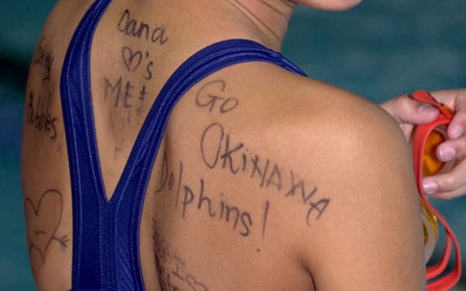 12-year-old Jesse Yamagata of the Okinawa Dolphins displays some body graffiti. "Back art" was all the rage among the five DOD swim teams present at the Junior Olympic meet.