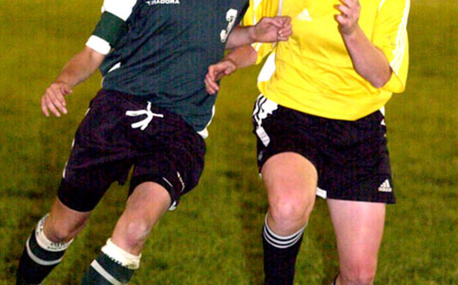 Erin Foote, left, dribbles past Kadena&#39;s Courtnie Paschall during last year&#39;s Far East Class AA final. Foote entered the season with 89 goals in three years and has four goals so far this season for the 1-1 Dragons.