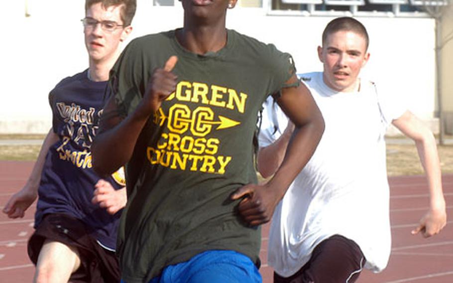 Philip Small, Peter Kamau and Catlin Conners at track and field practice at Eagles Field, Robert D. Edgren High School, Misawa Air Base, Japan.