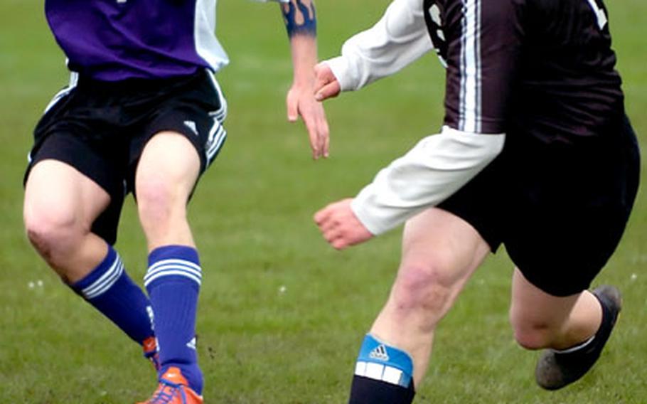 Patch's Flavius Garmacea, right, and Mannheim's Martin Killinger race for the ball during Friday's high school soccer game in Mannheim, Germany. The teams tied 0-0.