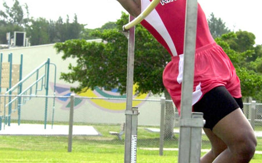 Nile C. Kinnick senior Leonard Lynce clears 6 feet, 4 inches in the high jump Saturday. Despite setting a school and personal record, Lynce finished second by one inch to Jun Dambara of St. Mary&#39;s International.