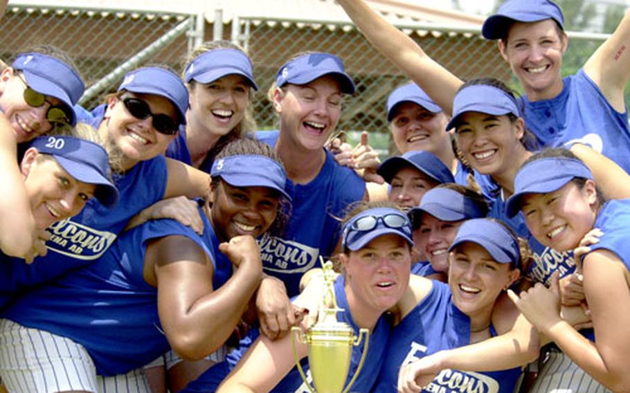 Members of the Kadena Falcons women's softball team of Okinawa whoop it up after Monday's championship game in the 2005 Pacificwide Open Softball Tournament at Lombardo Field FourPlex, South Post, Yongsan Garrison, South Korea.