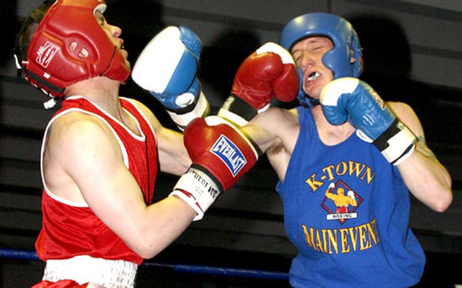 Michael Lewis, left, of Baumholder and Adam Klakowicz of Heidelberg trade leather in a novice light welterweight bout. Klakowicz remained unbeaten in seven military matches, beating Lewis, 3-0.