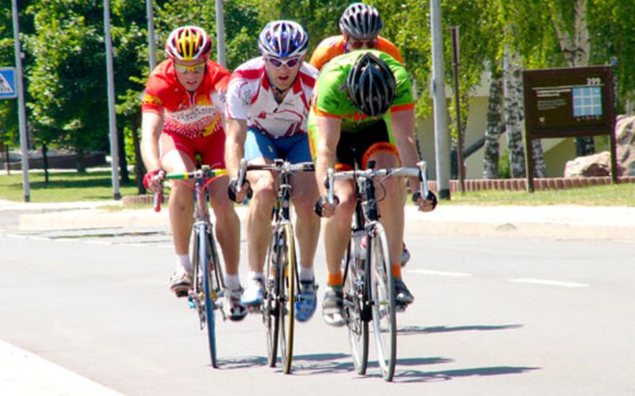 Eventual open winner Thomas Essick, left, Kirk Winters, center, and Herbert Crites, rear, draft behind open runner-up Mark McClay of Spangdahlem during an uphill stretch of Saturday&#39;s U.S. Forces Europe Road Cycling Series race at Spangdahlem Air Base, Germany.