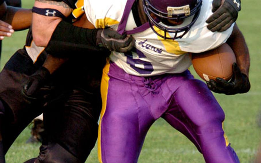 Yokota defender Patrick Piazza tackles Misawa running back Shandon Lane.