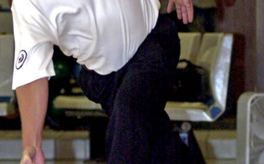 PBA Tour bowler and ESPN analyst Randy Pedersen releases the ball during during Friday’s “Beat the Pro” appearance at Emery Lanes, Kadena Air Base, Okinawa. Pedersen competed against the winner of an elimination bowling tournament among American adults at Kadena.