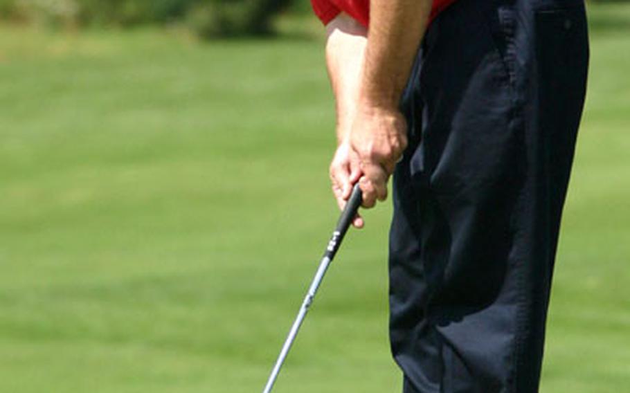 Jeffrey Hallauer makes his final putt on the 18th hole to clinch victory in the 2005 Army Europe Golf Championship at the Stuttgart Golf Club in Kornwestheim, Germany. (spt# 61p pp)