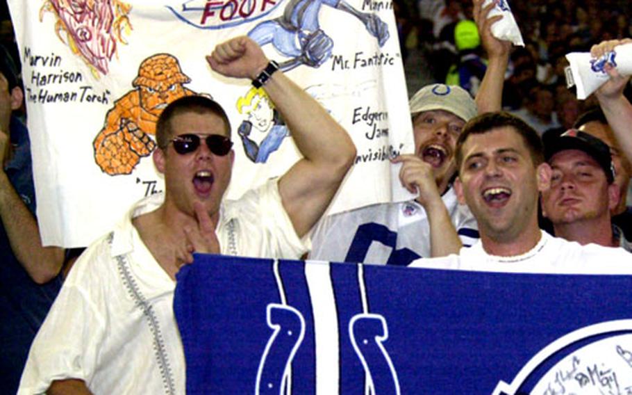 Petty Officer 3rd Class Danny Schrade and Seaman Travis Lashley cheer on the Indianapolis Colts during Saturday’s NFL preseason American Bowl at Tokyo Dome. The Atlanta Falcons beat the Colts 27-21.