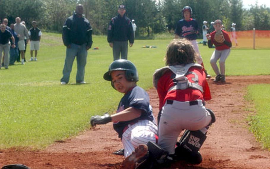 Doug Snyder of Naples, Italy, gets tagged out at home by Belgium catcher Henry Lang to finish a double play in the bottom of the fifth inning.