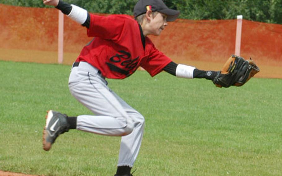 Brussels second-baseman Jesper Nilsson lunges to make a catch in Wednesday&#39;s game against Ramstein.